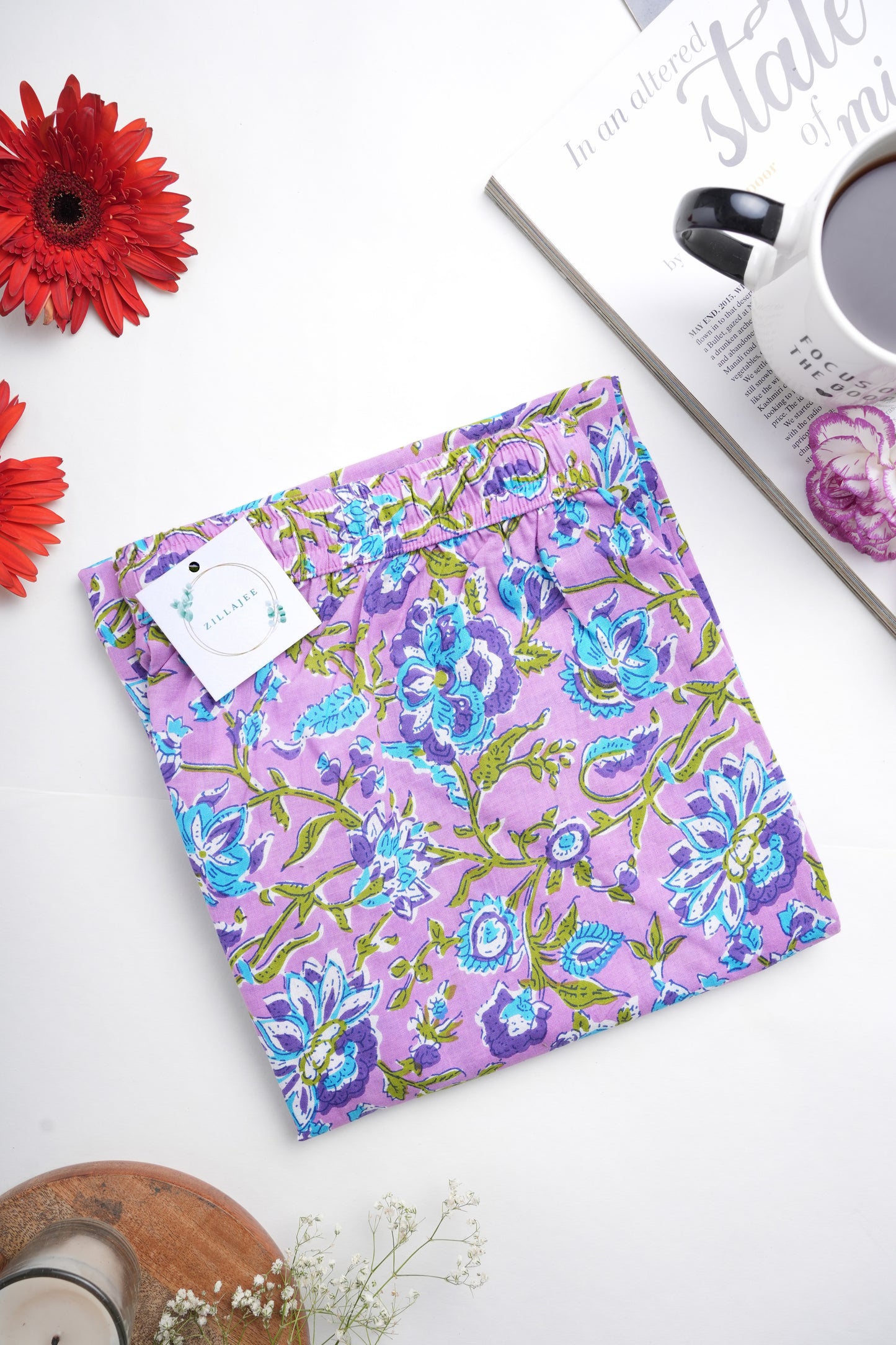 Relaxed-fit jammies with breathable cotton, tropical blue flower print, functional drawstring waist, and deep side pockets — a unique sleepwear choice for gifting or personal comfort.