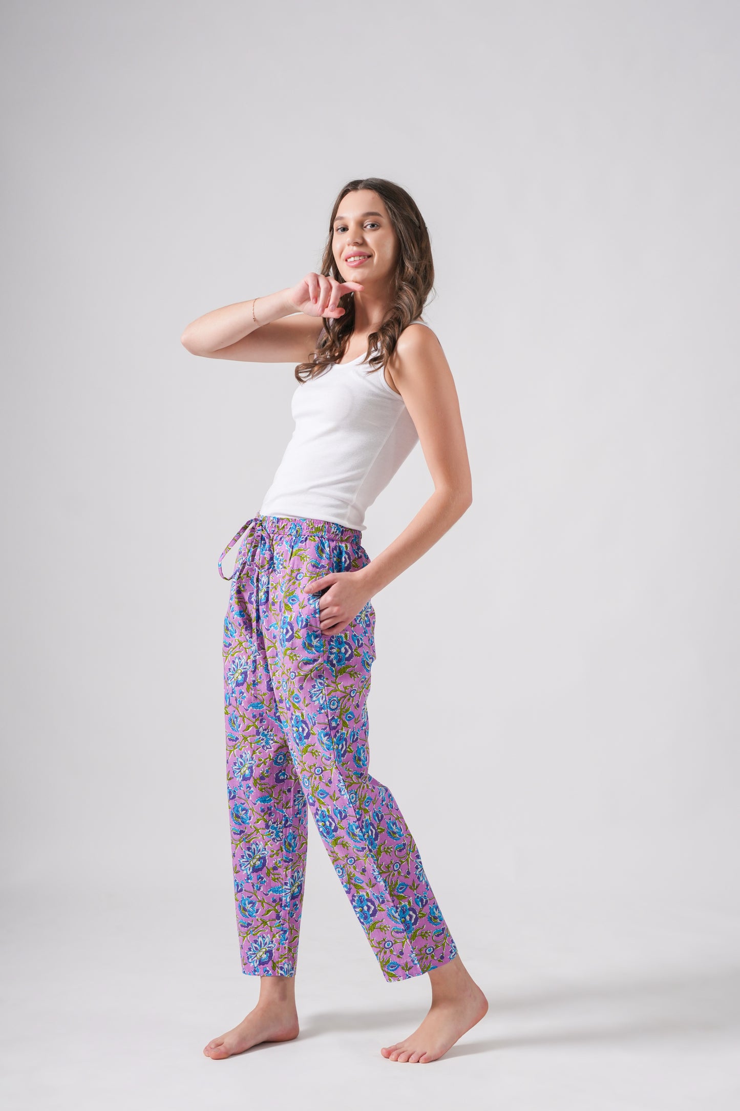 Comfy floral pj pants with pockets and elastic waist in breathable cotton, featuring a trendy lavender and blue pattern — a practical and cute bridesmaid sleepwear gift.