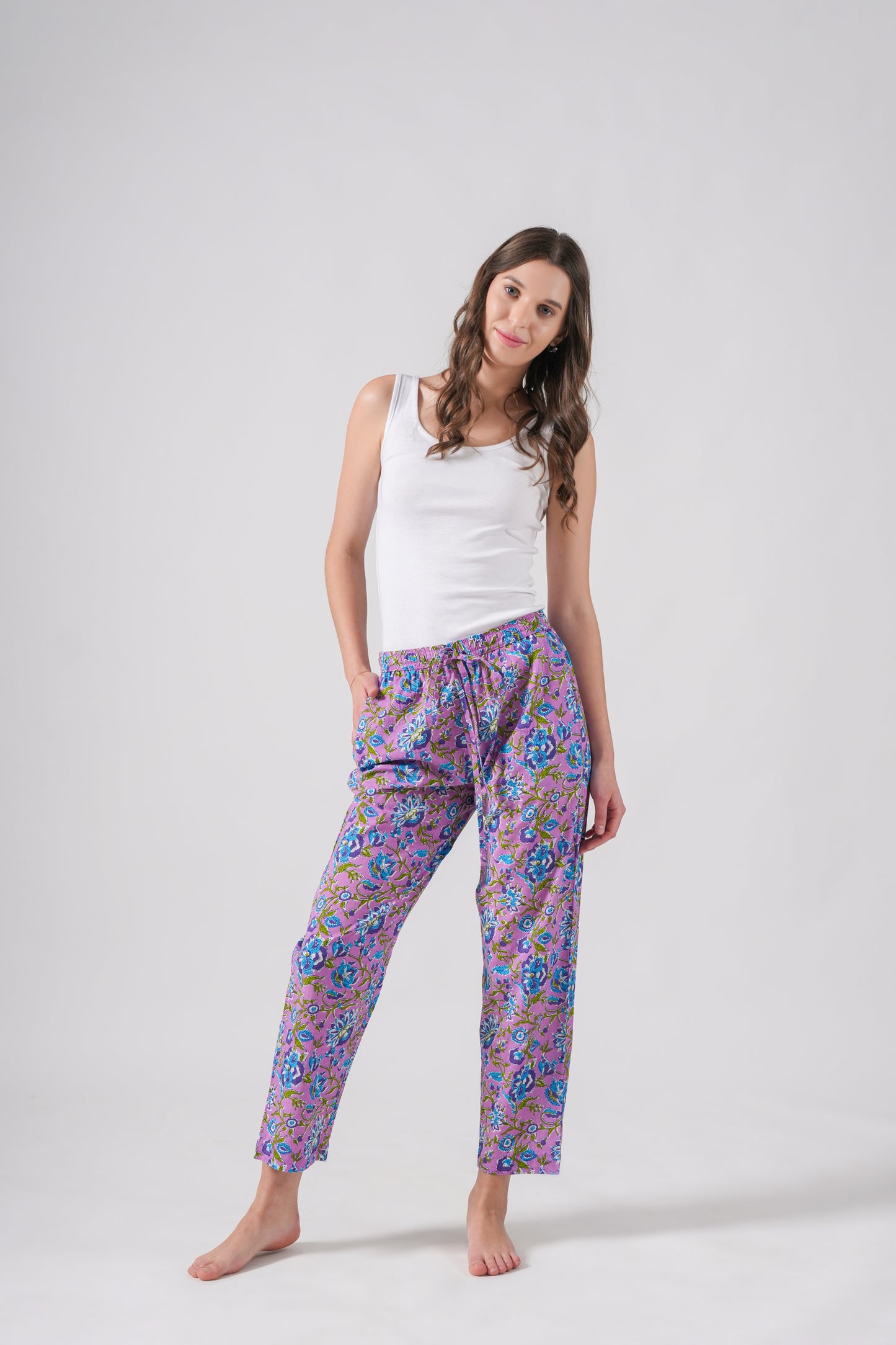 Soft cotton pajama pants for women with tropical floral print, deep pockets, and drawstring waist — modern and trendy for at-home wear or special gift occasions.