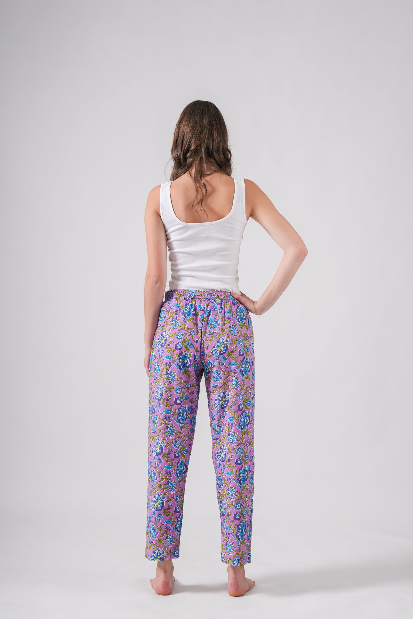 Women’s 100% cotton pj pants with a vibrant blue floral print on lavender, featuring roomy side pockets, an elastic waistband, and adjustable drawstring — a lovely bridesmaid proposal gift idea.
