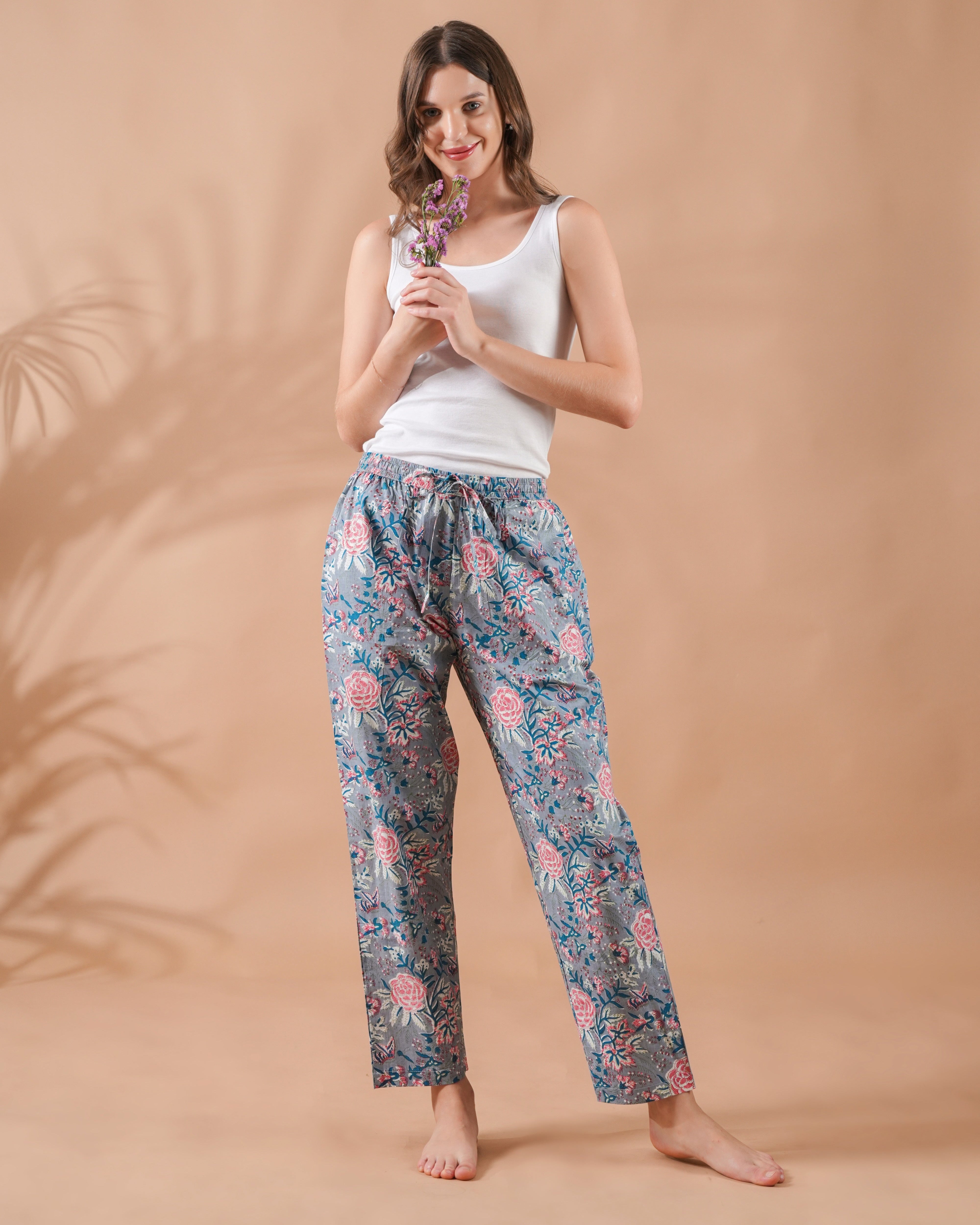 Breathable cotton pj pants in light gray with pink flowers, side pockets, and elastic waistband—great for bridal party pajamas, unique cotton anniversary gifts, or relaxing evenings.
