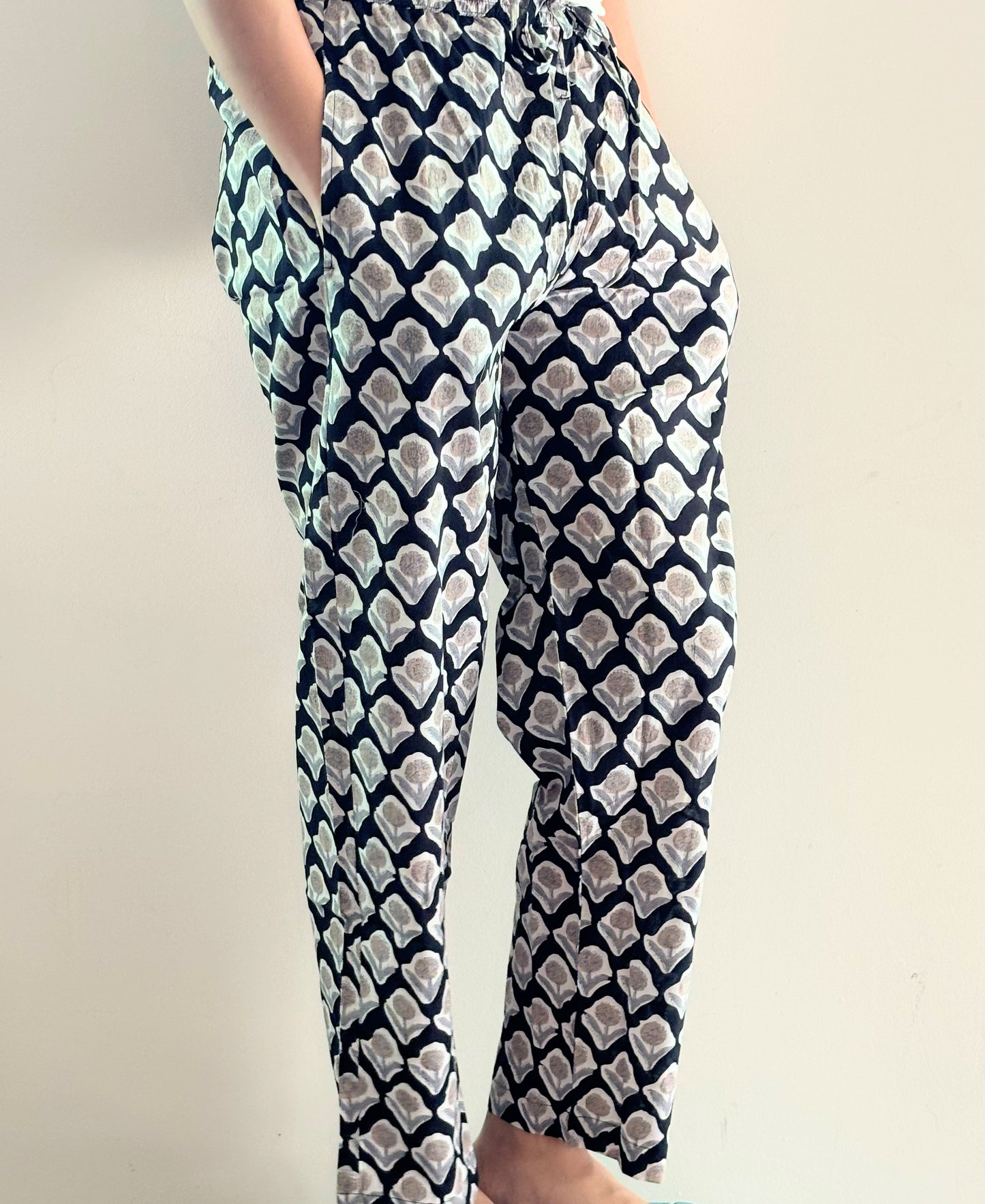 Printed cotton lounge bottoms for women in black with brown flower pattern, comfy, and breathable fabric.