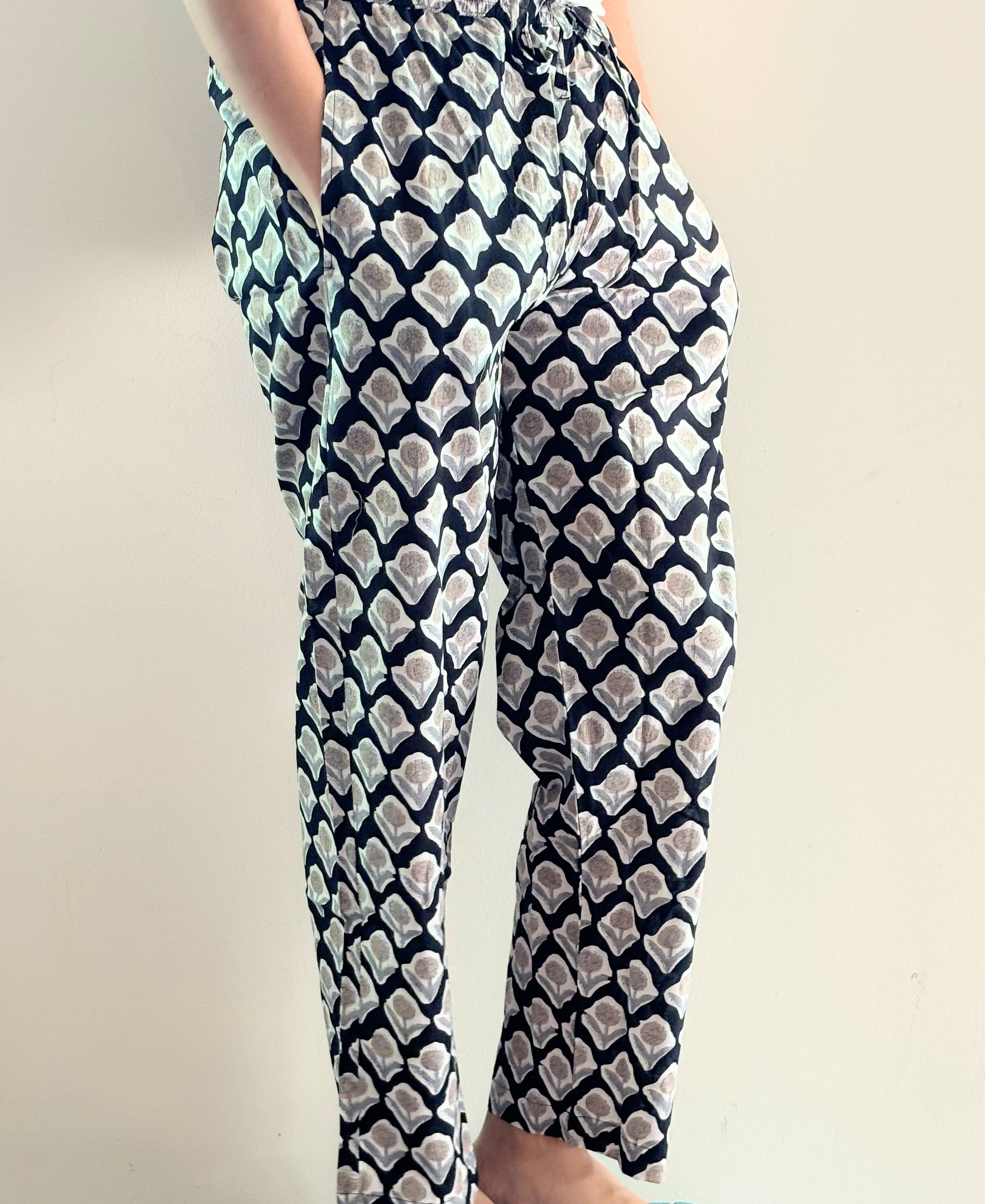 Printed cotton lounge bottoms for women in black with brown flower pattern, comfy, and breathable fabric.