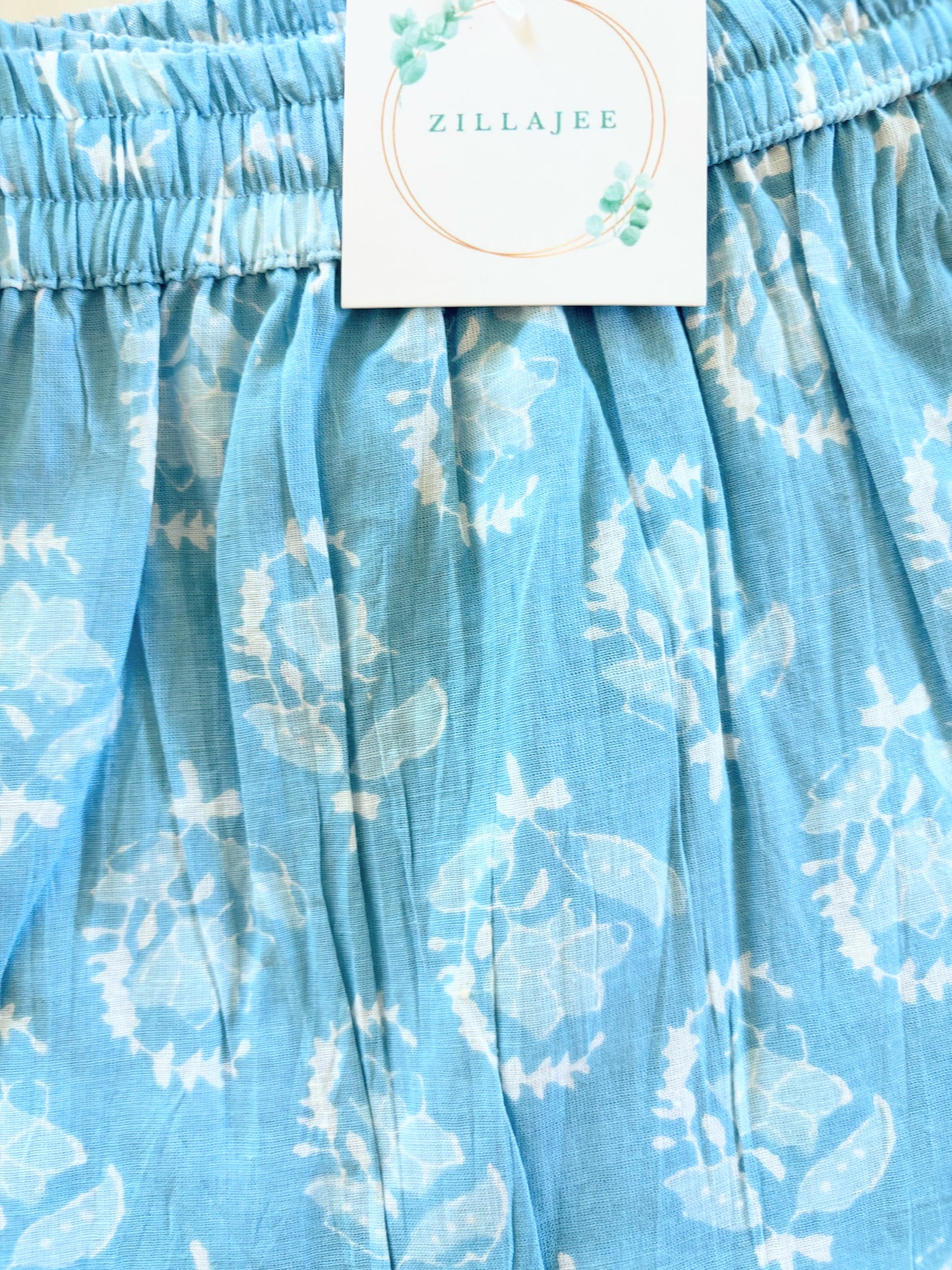 Vibrant cotton sleep pants with an elastic waistband and drawstring, featuring a feminine floral print, offering comfort and style for lounging or sleep.