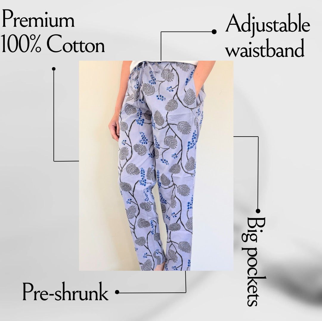 Relaxed fit cotton lounge pants with a chic black and blue floral design on violet-blue, perfect for sleep or leisure.