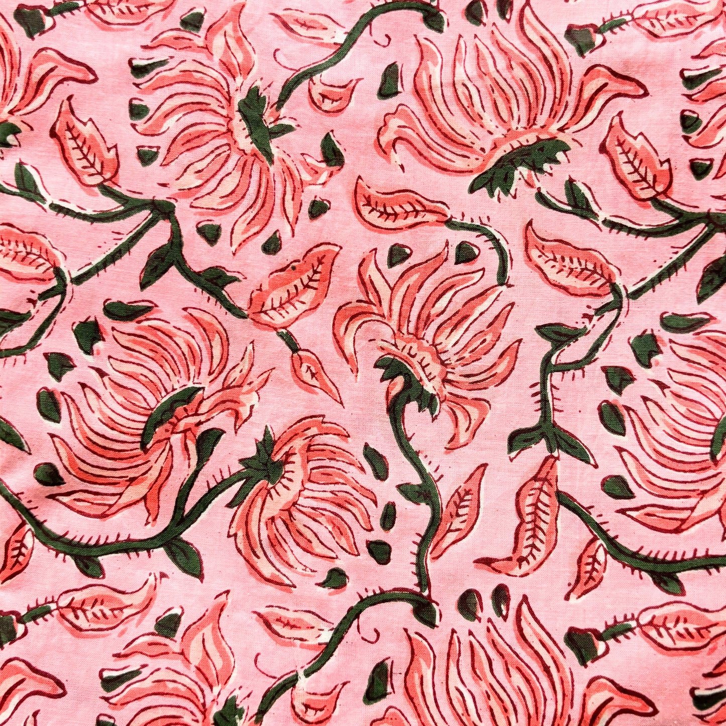 Lightweight cotton sleep pants with pink flowers on light pink, perfect for staying cool and comfortable while relaxing.