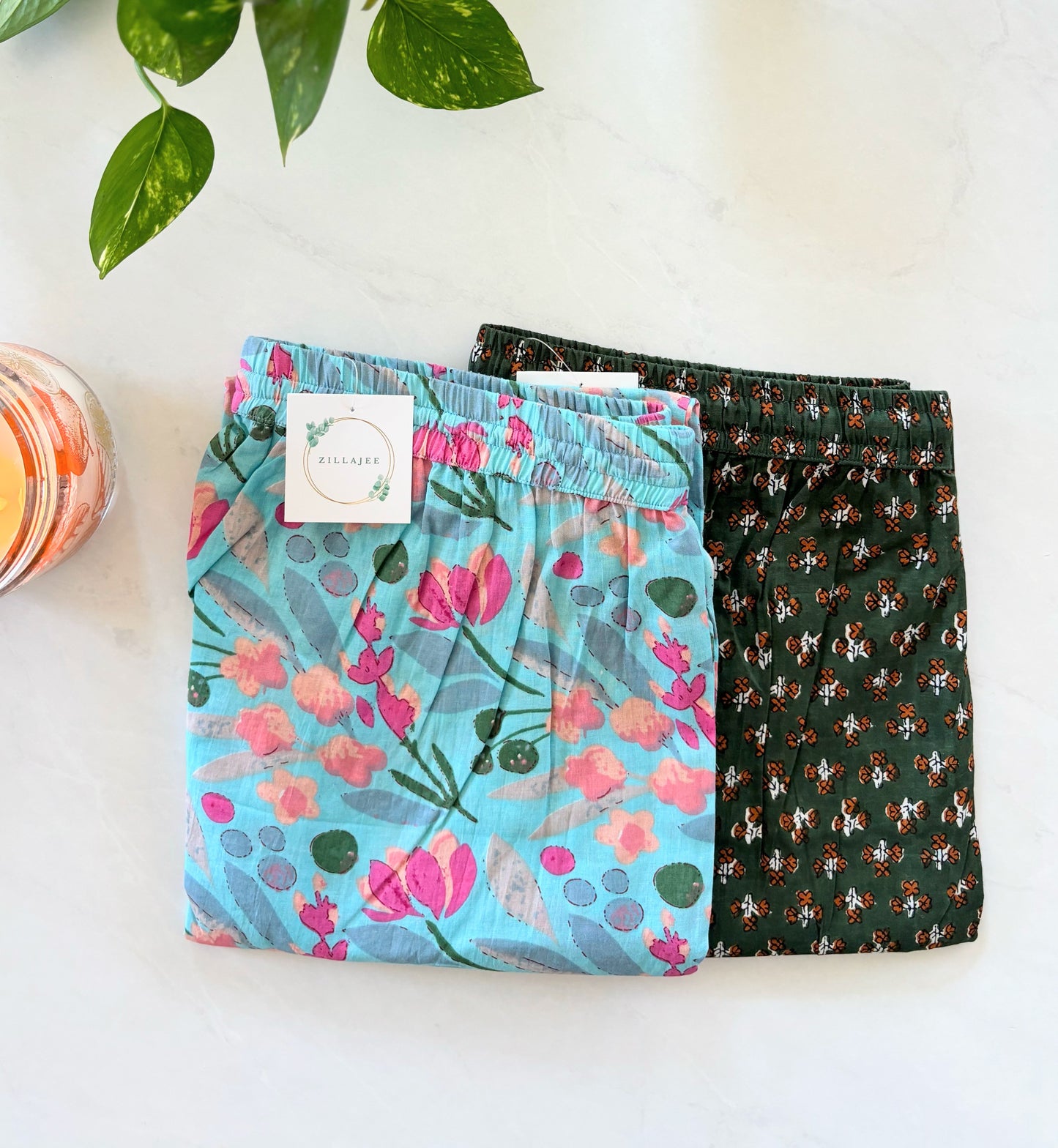 Two pairs of cotton lounge pants in blue and grey colors with elastic waistband