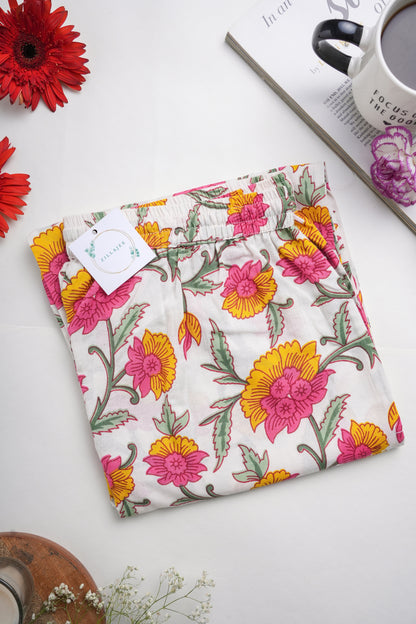 Floral print sleep trousers for women made from breathable cotton with elastic waistband, drawstring, and functional pockets — unique menopause gift idea.