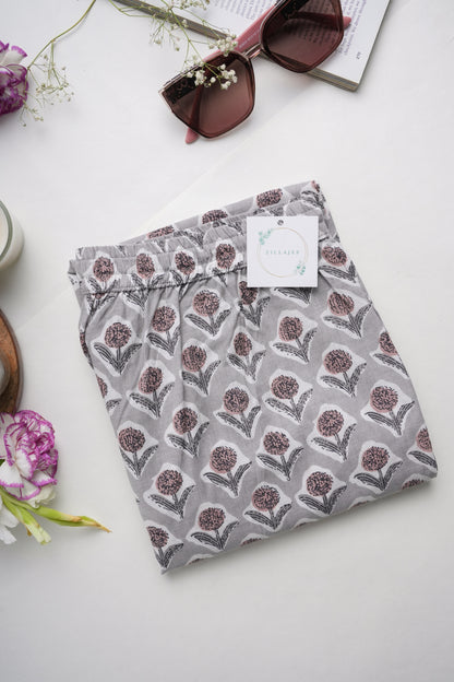 Women’s 100% cotton pj pants with soft elastic waistband, adjustable drawstring, and deep pockets, featuring a gray base with bold brown floral print — ideal as a bridesmaid proposal gift idea or everyday loungewear.