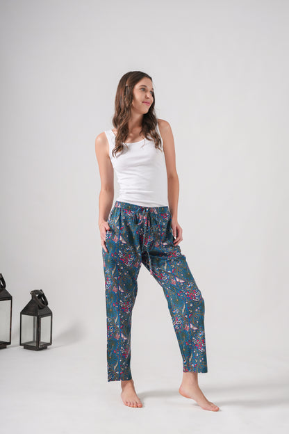 Handmade cotton pajama bottoms with pink flowers and butterflies, ideal as a bridesmaid proposal gift, complete with elastic waistband and deep side pockets for relaxed lounging or sleep.
