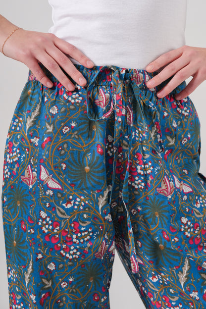 Floral bridesmaid pajamas in all-natural cotton with pink butterfly pattern on navy, designed with roomy pockets and a flexible waistband for all-day comfort during getting ready moments.