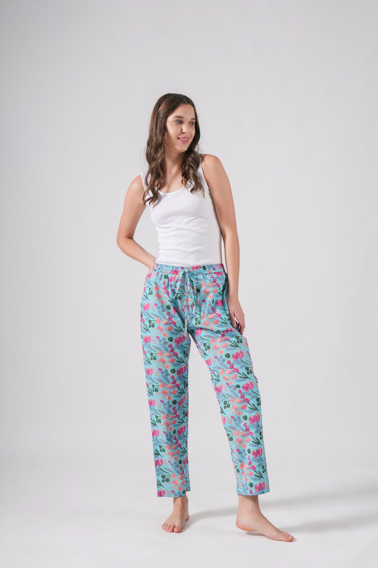 100% cotton pj pants for women in a vibrant blue with bold pink floral print, featuring a soft elastic waistband, adjustable drawstring, and deep pockets — ideal as a bridesmaid proposal gift or relaxing sleepwear.