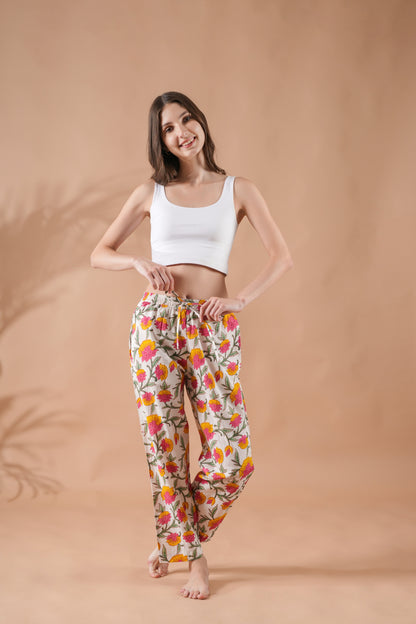 Breathable cotton pajama pants with pockets, pink and yellow flower design, and elastic waist — ideal bride getting ready outfit for a spring or summer wedding.
