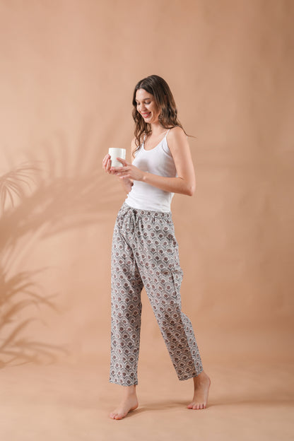 Gray pj pants with nature-inspired brown flowers, breathable fabric, side pockets, and elastic waistband — perfect sleepwear for gifting or relaxing at home.