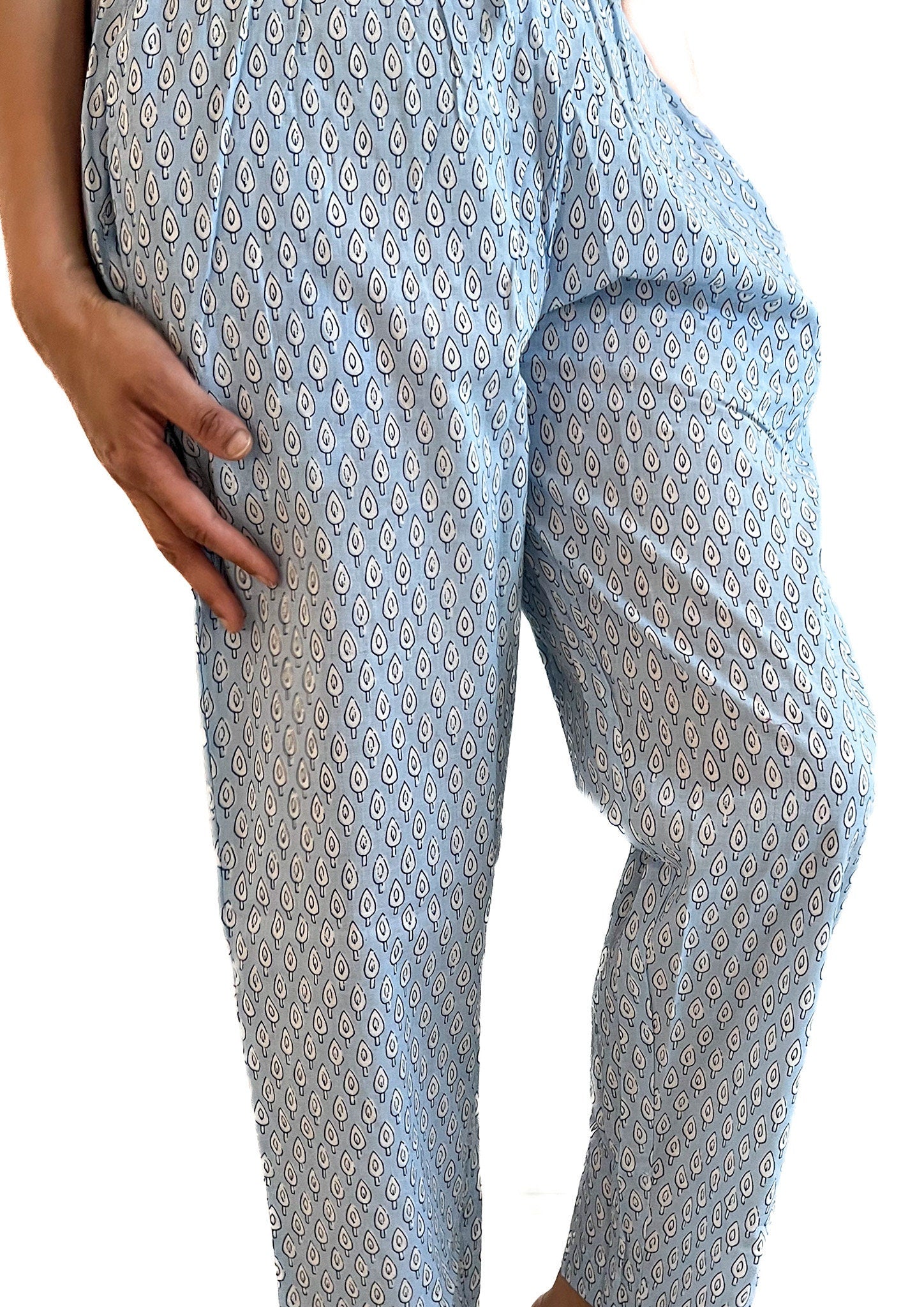 Soft cotton pajama pants for women with a modern blue and white abstract design, elastic waistband, and side pockets