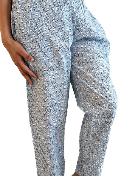 Soft cotton pajama pants for women with a modern blue and white abstract design, elastic waistband, and side pockets