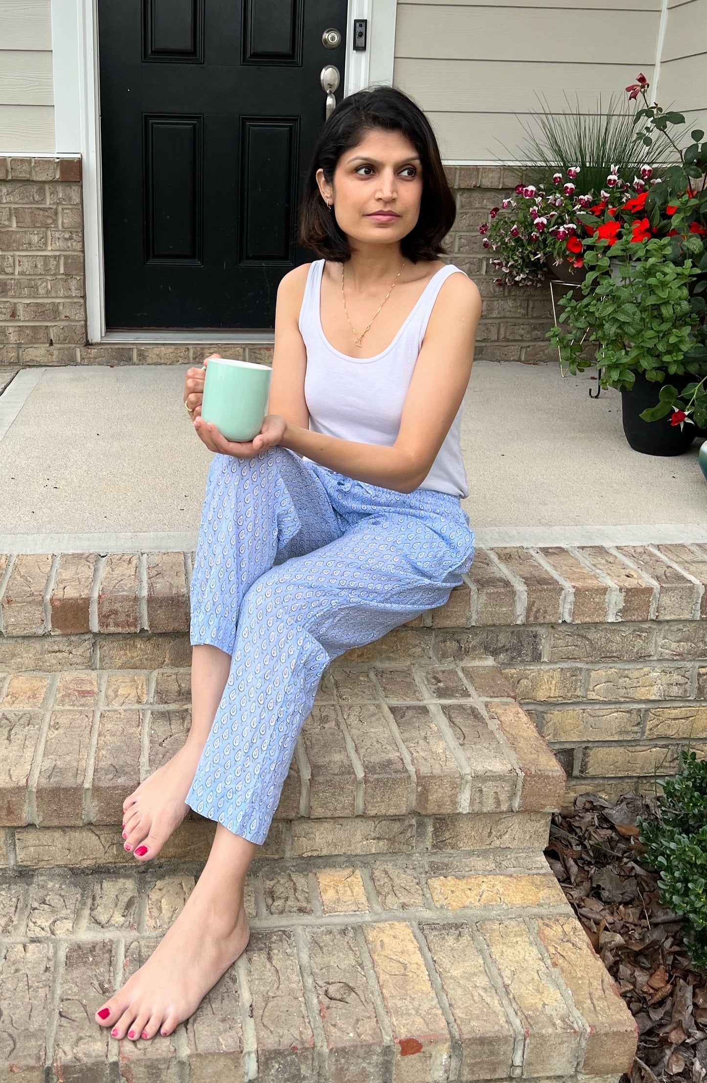 Stylish cotton lounge pants for women with a blue and white abstract design, featuring an elastic waistband and pockets.