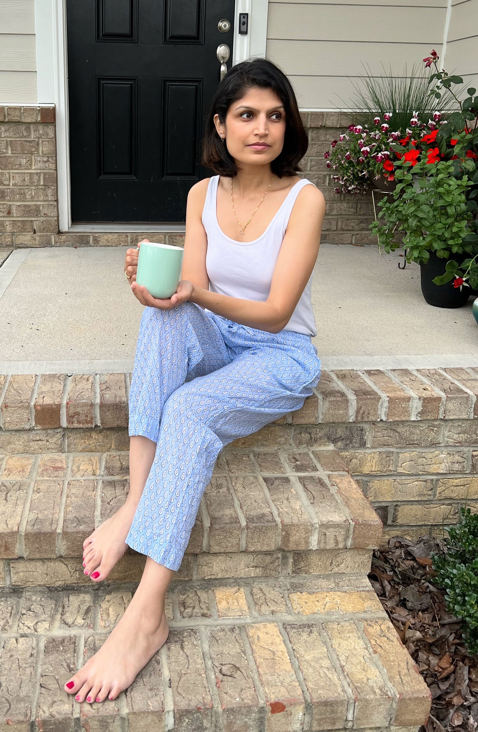 Stylish cotton lounge pants for women with a blue and white abstract design, featuring an elastic waistband and pockets.