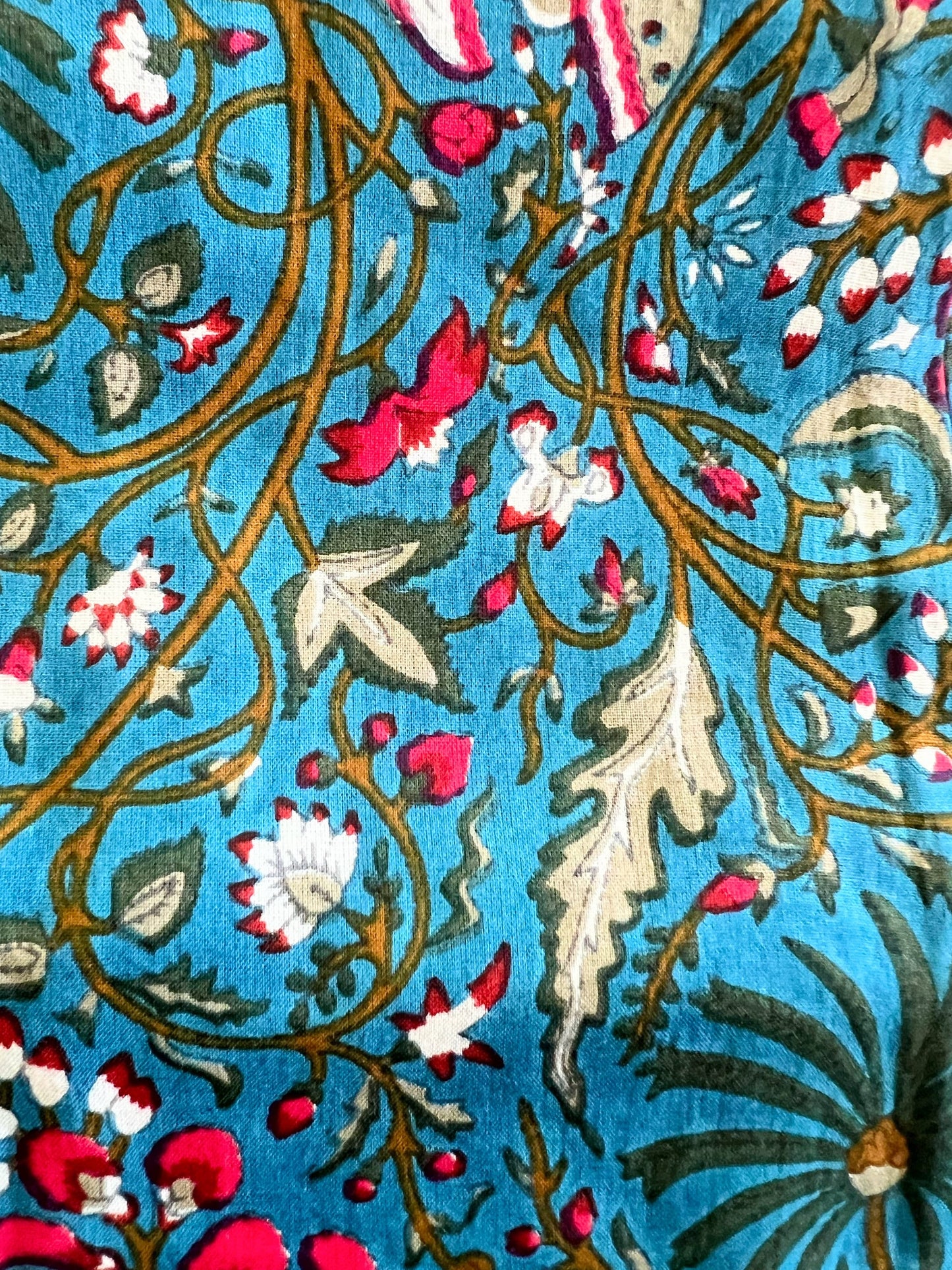 Dark blue cotton pajama pants with a floral design and butterflies, featuring an elastic waistband and side pockets. Perfect for lounging and unwinding at home.