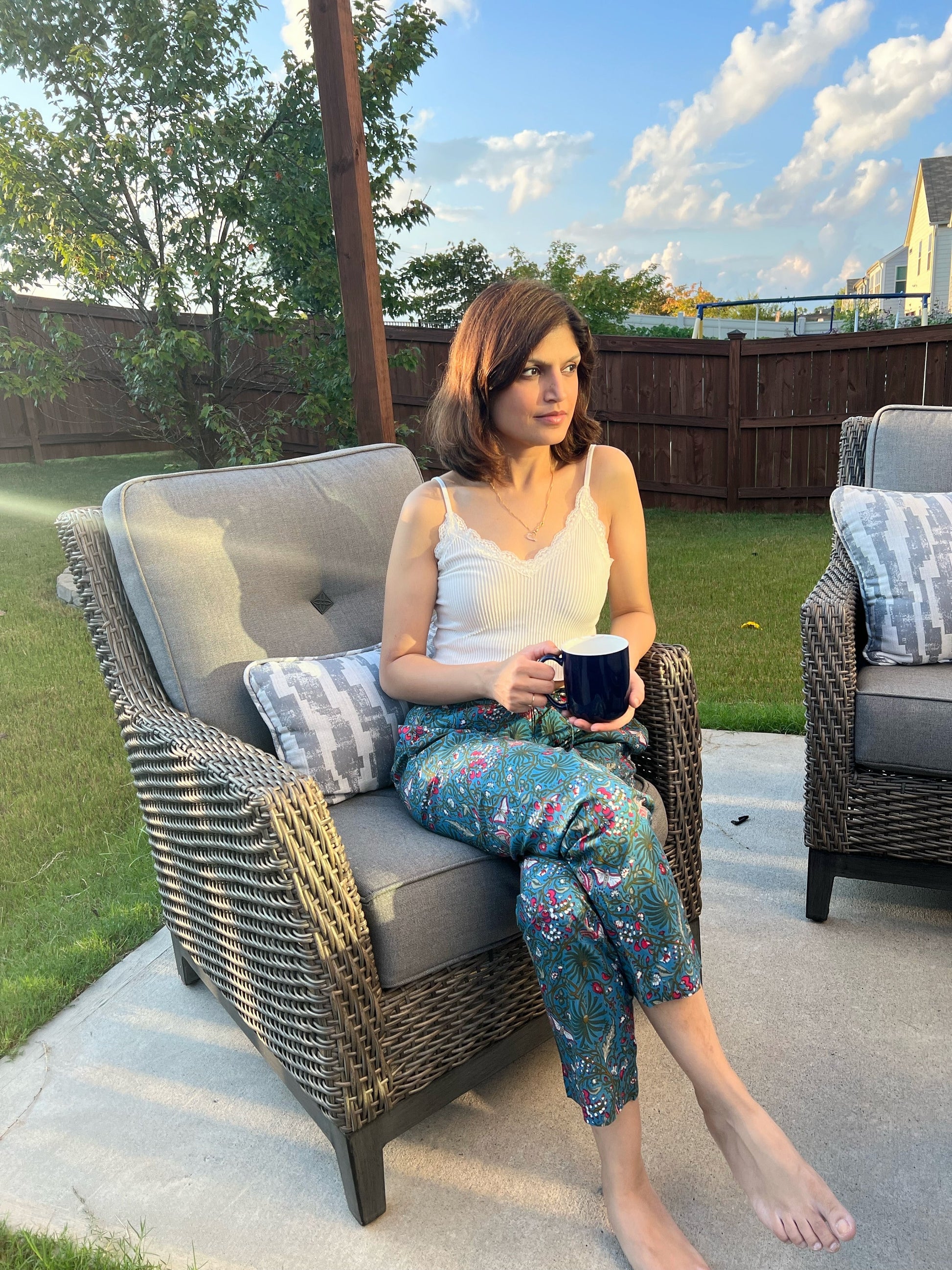 Women’s 100% cotton pajama pants with a dark blue floral print and butterflies. The pants include side pockets and an elastic waistband, making them perfect for lounging.
