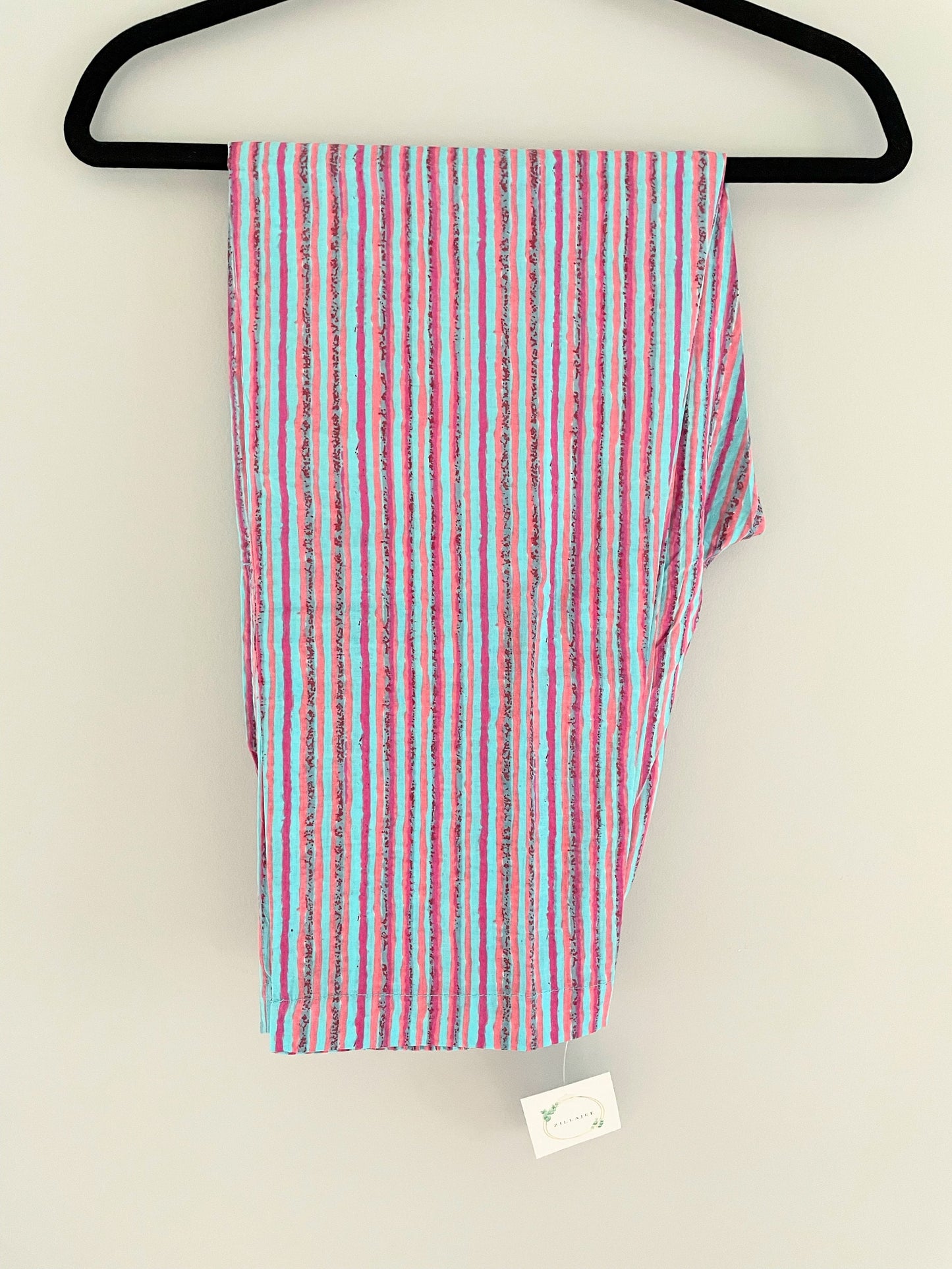 Cotton lounge pants for females with a blue and pink striped print. Soft, lightweight, and breathable—perfect for cozying up in bed.