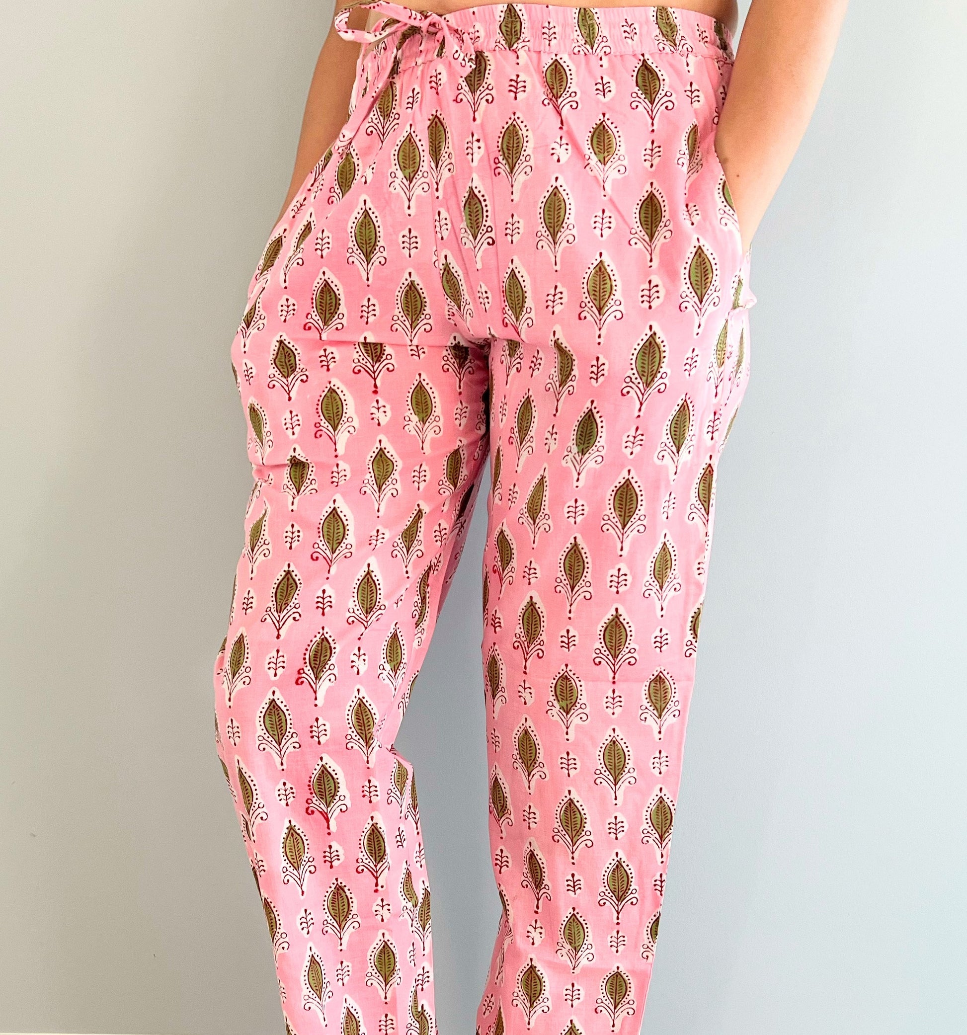 SEO Description: Shop these 100% cotton pajama pants for women featuring a rosy foliage design. Made with ethically sourced organic cotton and natural dyes, these comfy sleep pants come with an elastic waistband, drawstring, and deep pockets. Available in petite, short, tall, plus sizes. Ideal for new moms, girls' weekends, sleepovers, bridal showers, and bachelorettes. Enjoy FREE shipping and same-day dispatch from a small business in North Carolina, USA 🇺🇸.