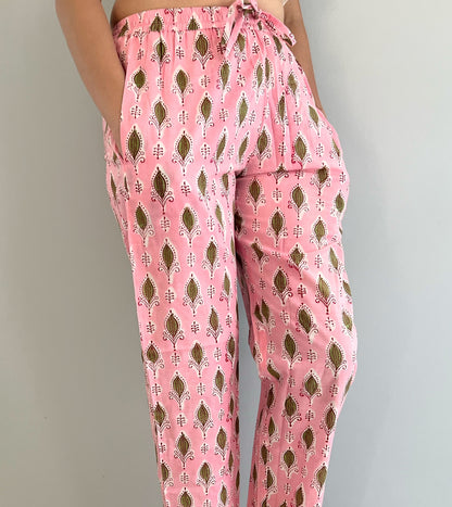 SEO Description: Shop these 100% cotton pajama pants for women featuring a rosy foliage design. Made with ethically sourced organic cotton and natural dyes, these comfy sleep pants come with an elastic waistband, drawstring, and deep pockets. Available in petite, short, tall, plus sizes. Ideal for new moms, girls' weekends, sleepovers, bridal showers, and bachelorettes. Enjoy FREE shipping and same-day dispatch from a small business in North Carolina, USA 🇺🇸.
