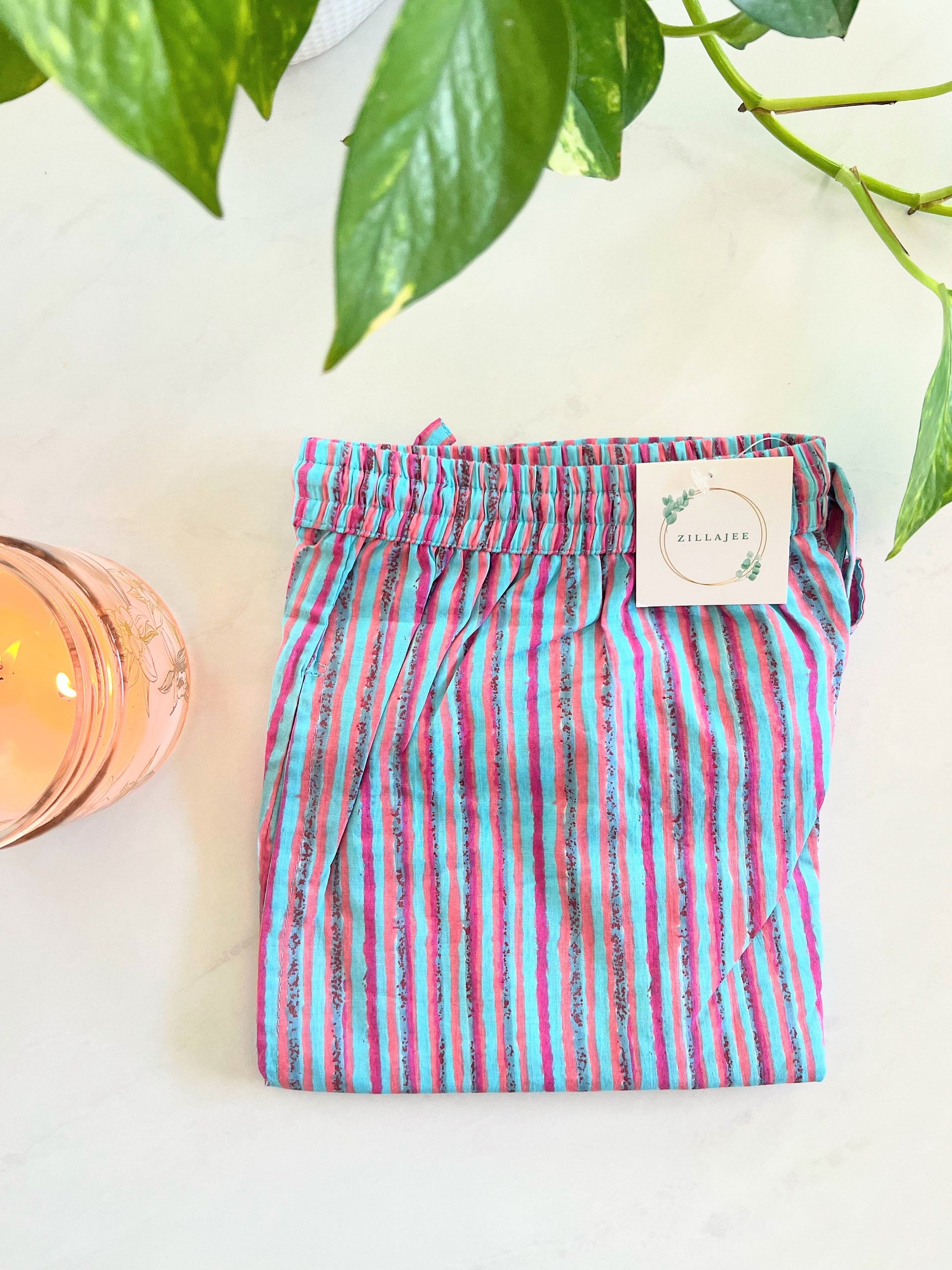 Women’s 100% cotton pajama pants with blue and pink stripes. Soft, cooling, and lightweight, perfect for lounging or sleepwear.