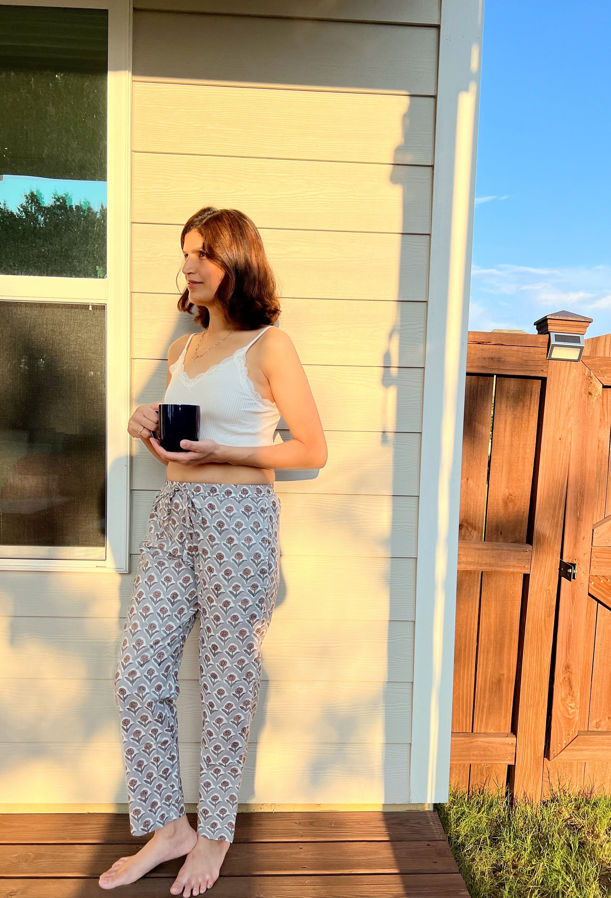 Set of 2 breathable cotton pajama bottoms for women, featuring a comfortable elastic waistband, drawstring, and vibrant floral designs—perfect for lounging in style.